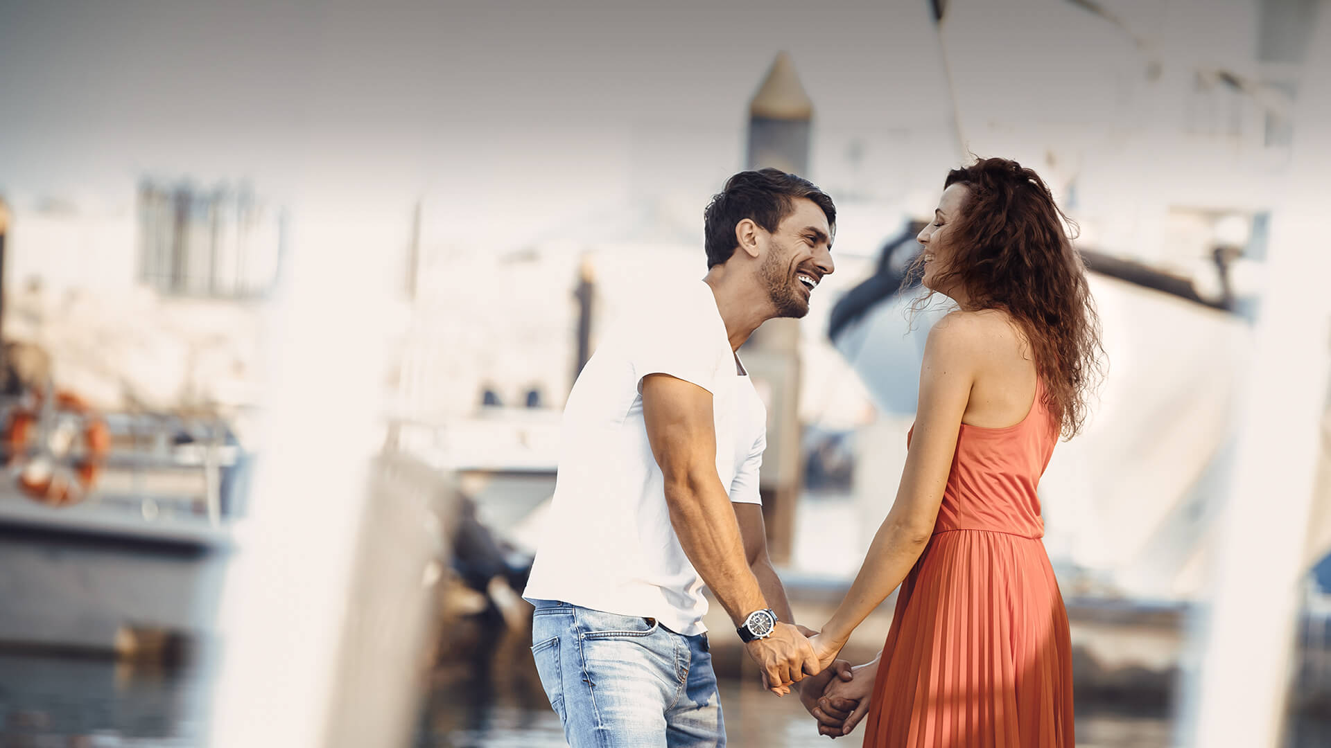 Arab dating symbolized by a man and woman holding hands and standing happily at the port