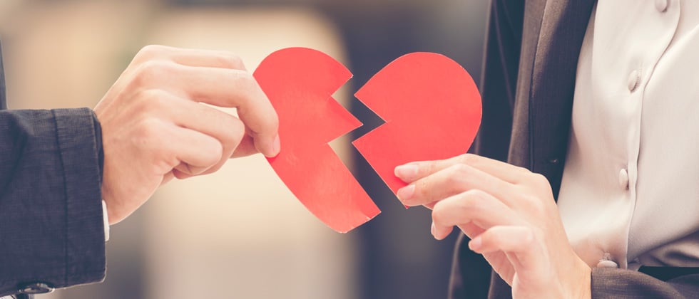 Getting a divorce symbolized by a broken heart out of paper