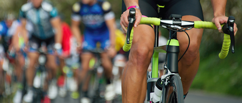 A group of cyclists buking in a race