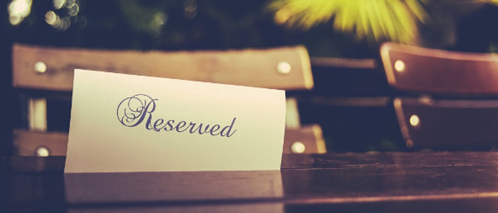 A picture of a reserved sign on a table