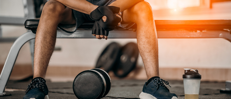 A guy at the gym about to do another set of weights