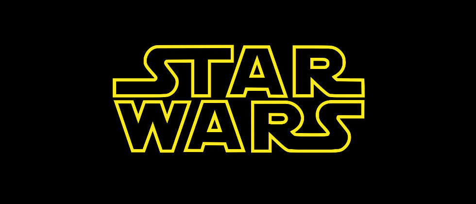 The star wars movie logo in black and gold