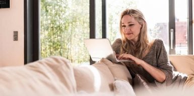 Single woman on laptop has a video date