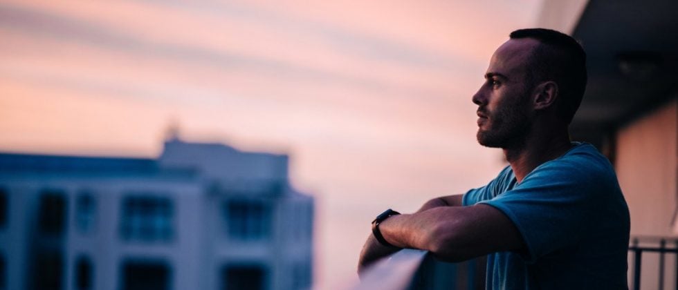 man looking into the vastness from a tower when he pulls away