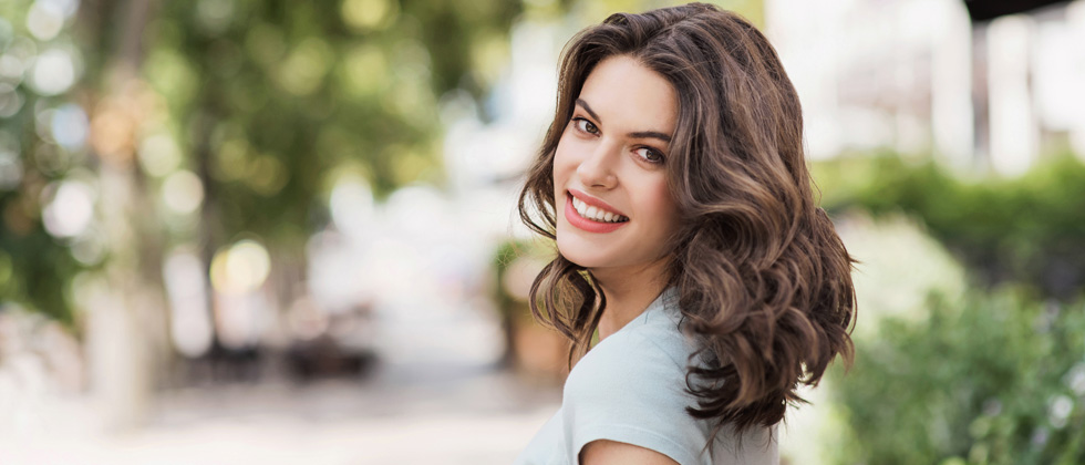 Woman looking deeply into the camera with big eyes