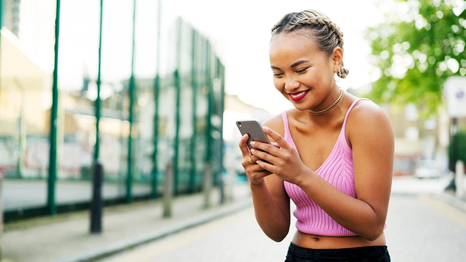 Woman on a phone similing