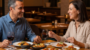 A couple enjoying mexican tapas in restaurant on a date. 