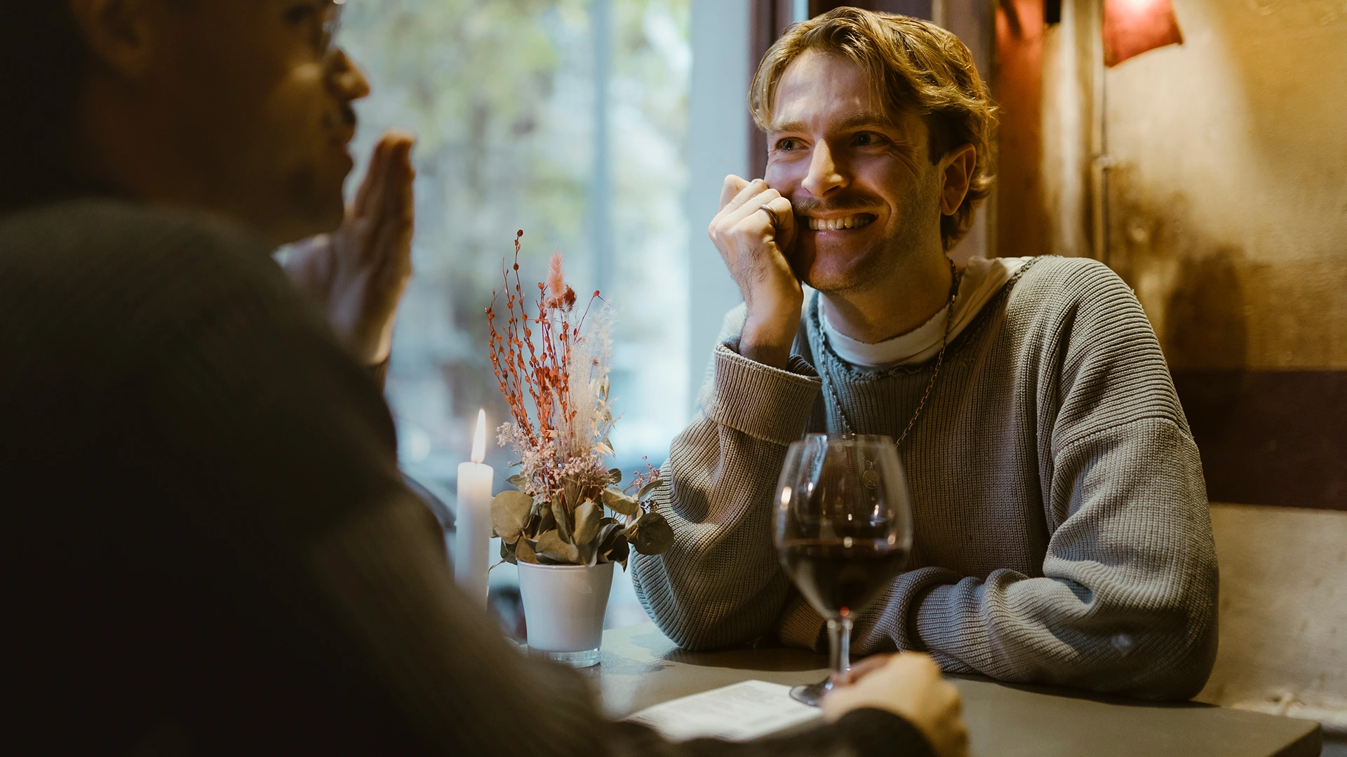 A gay couple on a date in an restaurant in chicago.