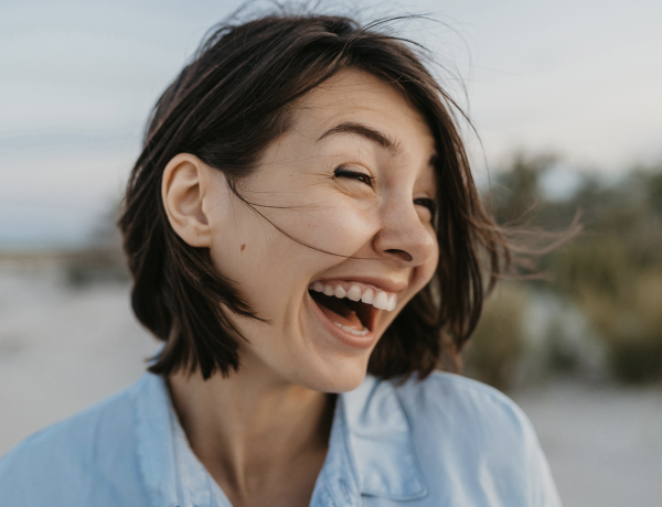 A woman is laughing as example for discover real you at eharmony