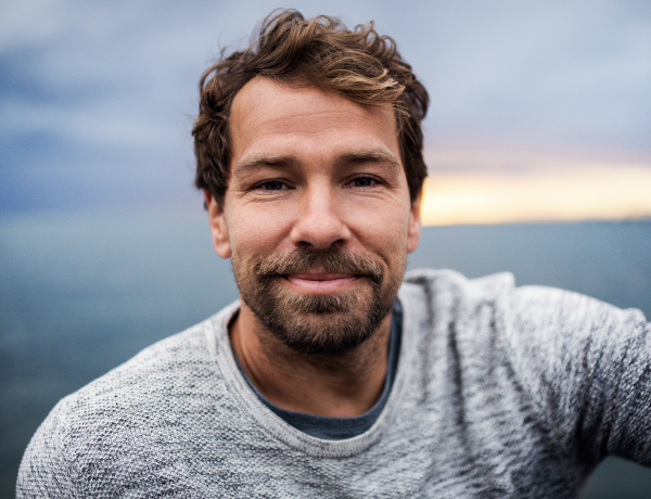 A man looks into the camera