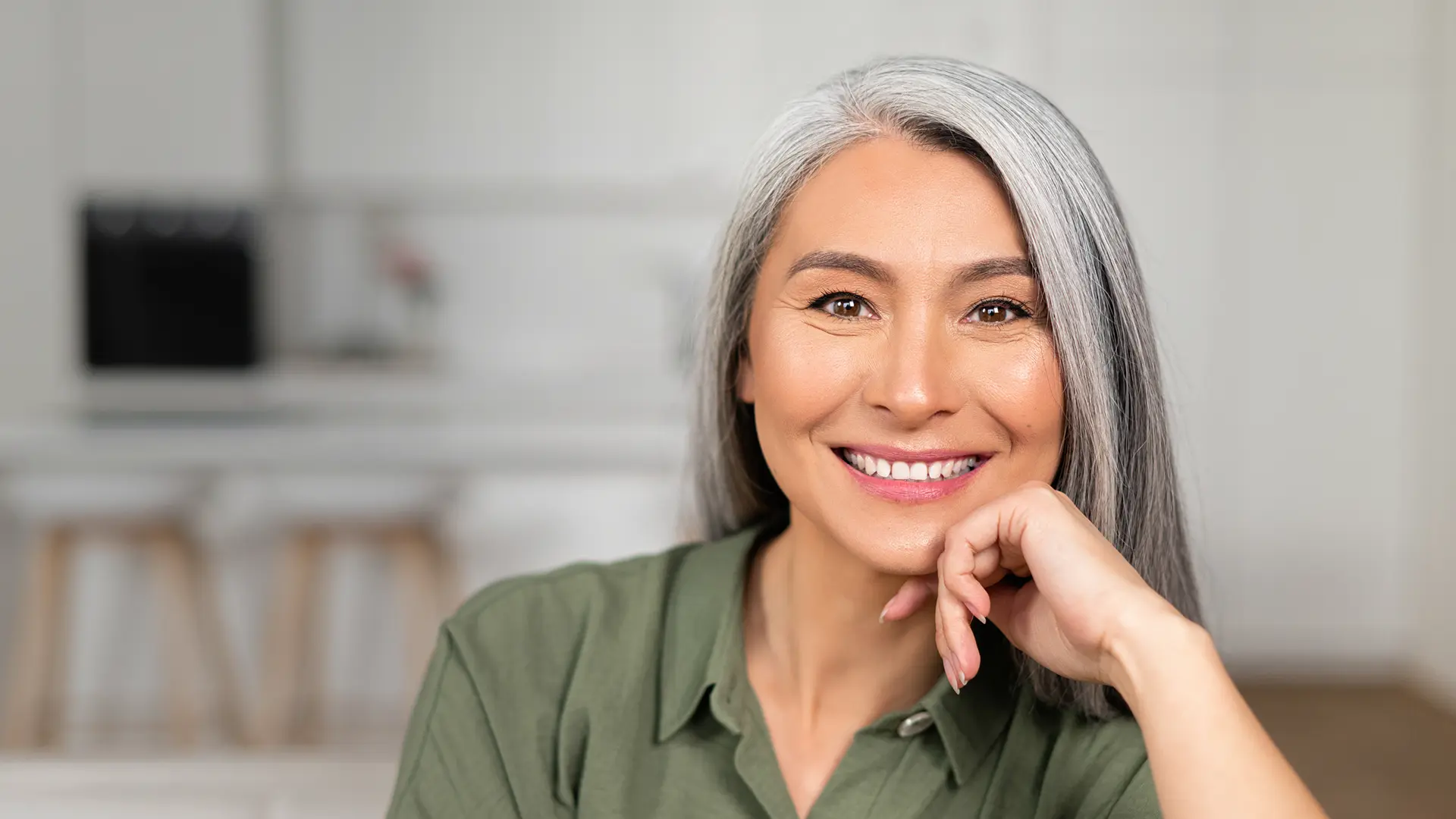 A middle aged Asian Single front facing the camera